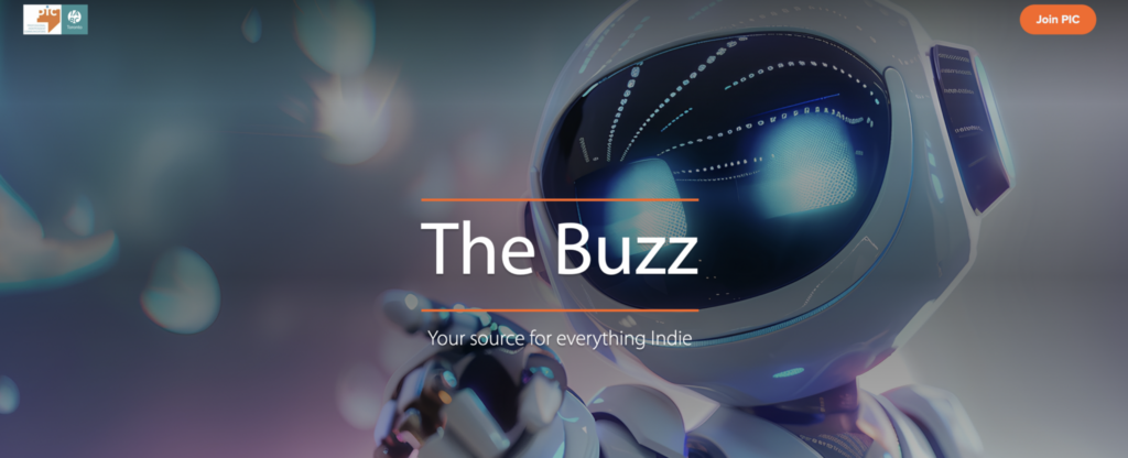 Against a blurry background, a grey robot with glowing eyes stretches its right arm to point a finger. Text reads, “The Buzz. Your source for everything indie.” The IABC/Toronto and PIC logos are on the top left and a “Join PIC” button top right. 